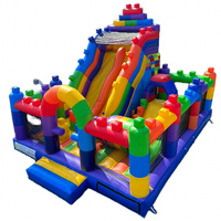 Château gonflable commercial en PVC avec toboggan et blocs de construction Lego, personnalisable en couleur et logo