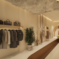 Présentoir en bois personnalisé de luxe léger pour vêtements pour femmes Mobilier de magasin suspendu avec étagères à panneaux de luxe
