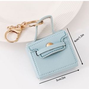 Porte-clés carré pliable en cuir PU couleur unie créatif, mini pendentif mignon pour clés de voiture, cadeau de mariage, souvenir, beau et petit - Product Image 1