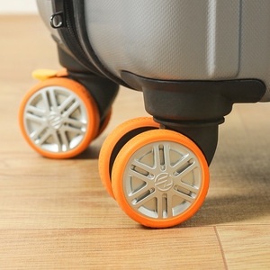 Silicone Suitcase Wheel Covers Large 8 Pack Orange Shock Absorbing Protective Luggage Accessories - Product Image 1