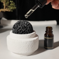 Décoration de la maison boules de pierre de lave de roche volcanique noire naturelle ensembles de support de ciment pour diffuseur d'huile aromathérapie