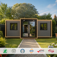 Maison modulaire préfabriquée moderne, revêtement gris foncé, finition noire, éclairage LED, façade en verre, mini-maison, ADU, maisonnette de jardin