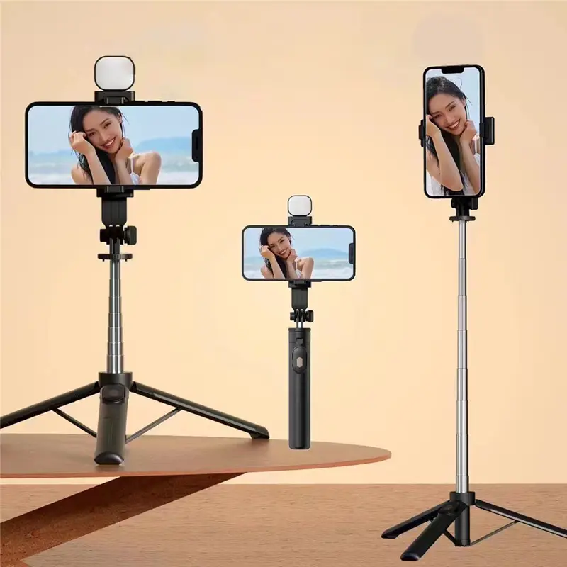 Nuovo Selfie Stick R1S con luce di riempimento di rotazione di 360 gradi di controllo Wireless portatile portatile Selfie Stick treppiede con supporto per telefono