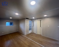 Maison conteneur extensible premium 20/40FT avec revêtement gris, pour maisons d'hôtes temporaires compactes, studios de jardin et logements secondaires