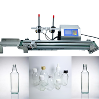Machine de remplissage avec quatre buses pour gin, vodka, et équipement de remplissage de bouteilles en verre à petite échelle pour spiritueux/alcool, whisky