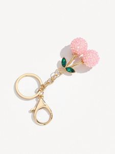 Porte-clés créatif et mignon en forme de cerise, en alliage orné de strass et de diamants, idéal pour voiture, sac ou comme cadeau décoratif. - Product Image 3