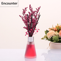 Diffuseur d'huile essentielle naturelle de parfum de parfum de décor à la maison de luxe dans le diffuseur de roseau de bouteille en verre avec le bâton de fleur d'arome