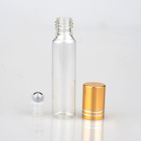 Flacon de parfum miniature rond en verre transparent de 10 ml, pas cher, personnalisé, pour huile essentielle, gloss à lèvres, avec bille roulante et bouchon métallique