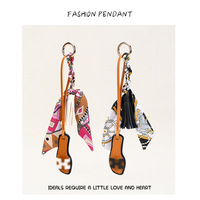 Nouveau porte-clés en cuir PU à pompon, écologique, tendance, pour sac, style coréen, pour accessoire de sac à dos