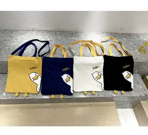 2024 lindos bolsos de hombro de compras de algodón para mujer, bolsos de moda de dibujos animados, bolso de mano de diseñador de lona de pato para colegiala