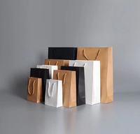 Bolsa de papel de regalo de lujo con logotipo impreso personalizado al por mayor bolsas de papel de compras de boutique al por menor con su propio logotipo