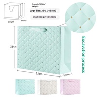 Sacs cadeaux en papier matelassé pastel imprimés offset avec poignées en ruban pour les faveurs de mariage et les projets d'artisanat