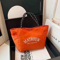 Nouveau Sac à langer élégant en nylon de style japonais, inspiré des influenceurs, ambiance dopamine, minimaliste, avec lettrage, grande capacité et fermeture magnétique, collection 2025