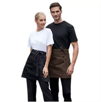 Tablier de serveur court en coton polyester noir à 3 poches et 2 poches pour la cuisine, le café et le bar.