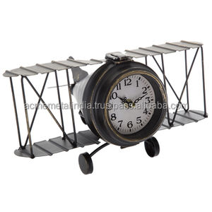 Horloge de table en forme d'avion en métal avec revêtement nickelé, idéale pour une décoration intérieure unique - Product Image 1