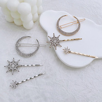 Barrettes à cheveux élégantes vintage en strass plaqué or Crownia, style européen et américain, avec éléments étoile et lune, vente en gros