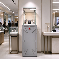 Vitrine de présentation de montres en métal gris avec dessus en verre industriel, éclairage LED, bouton rouge, CE ETL pour magasin de montres