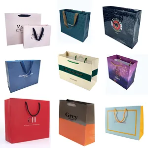 Sacs imprimés pour vêtement fourre-tout euro cadeau sac en papier vente en gros marque logo personnalisé emballage shopping papier au détail de haute qualité luxe