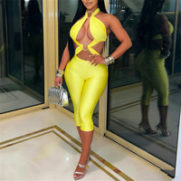 Combinaison moulante sexy ajourée pour femme avec anneaux métalliques et bandage, idéale pour les soirées, clubs, raves et festivals