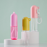 Flacon pulvérisateur de parfum de poche rond en plastique de 20 ml avec logo personnalisé, idéal pour les voyages, avec pompe à brume et porte-clés