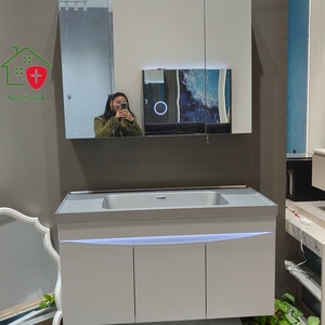 Nouvelle armoire de salle de bain blanche avec corps de meuble à trois portes et lavabo gris sur comptoir. - Product Image 6