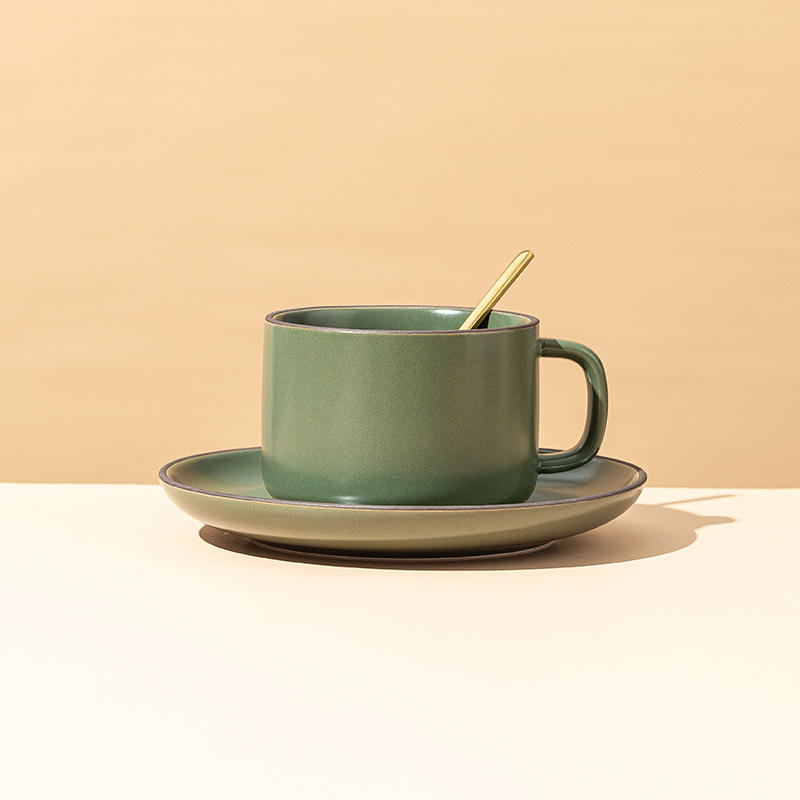 Dark green coffee cups, plates and spoons