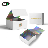 Boîte d'emballage rigide pliable pour perruques, recyclable, avec paillettes holographiques, design gaufré à la feuille d'or, doublée d'éponge, taille personnalisée pour gloss à lèvres