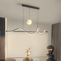 Nouvelle lampe de salle à manger et lustre de table à manger, moderne et simple, de style italien minimaliste, créative et personnalisée, avec un motif de lune