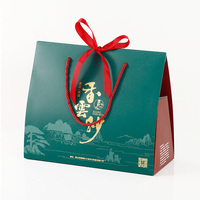 Boîte à friandises portable de luxe en gros, style chinois, pour cadeaux de festival, avec feuille d'or verte, revêtement UV, auto-érectible et nœud en ruban rouge
