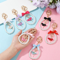 Boutons de manchette en métal style Ins avec nœud perlé, accessoire créatif fait main, porte-clés en cristal Fille de ballet pour toutes les saisons