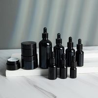 Bouchon à vis rond en verre de luxe en gros flacon compte-gouttes d'huile essentielle de sérum de parfum avec compte-gouttes noir