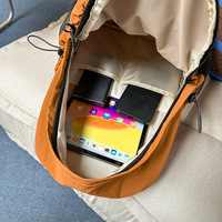 Sac à dos décontracté imperméable en nylon, grande capacité, portable, pour l'école, couleur unie, avec bretelles à coussin d'air, unisexe