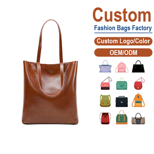 กระเป๋าโท้ทหนังวัวชั้นบนสุด สีน้ำตาลคาราเมล สไตล์มินิมอล พรีเมียม ความจุเยอะ เหมาะสำหรับเดินทาง สะพายไหล่หรือถือใต้วงแขน รับผลิตแบบ OEM - Product Image 1