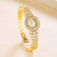 Montre en cuivre incrusté de zircon de haute qualité, de marque, élégante et raffinée pour femmes
