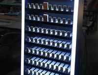 Présentoir en métal pour magasin de tabac Présentoir pour magasin de fumée personnalisé avec système de poussoir Présentoir à cigarettes à vendre