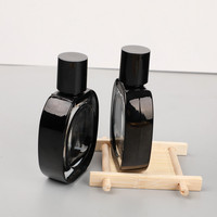 Botella de Perfume de Vidrio Ovalada de 30 ml con Borde Negro y Tapas Negras, Personalizable con la Etiqueta de su Marca