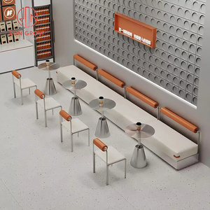 Set di Arredamento Commerciale per Ristoranti: Divano a L in Pelle Bianca per Caffetteria, Tavoli Rotondi in Metallo e Sedie Arancioni per Bar - Product Image 3