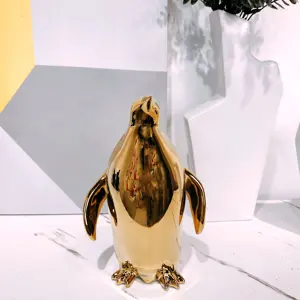 Moderno stile nordico in ceramica accessori per la decorazione di lusso per la casa Golden pinguino a forma di scultura per la camera confezionata in scatola