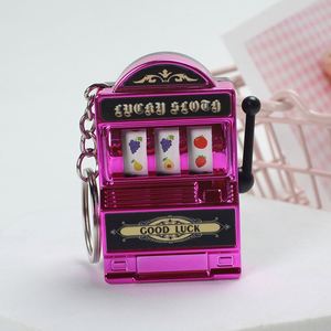 Mini porte-clés machine à sous, finition métallique dorée, avec manivelle fonctionnelle et rouleaux, souvenir de casino, accessoire, cadeau de fête, cadeau pour collectionneurs - Product Image 5
