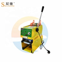 Shuangchi Électrique Bubble Tea Boba Jus Tasse Machine À Sceller Papier Matériel Main Manuel Plateau De Table Scellant pour Lait Boissons