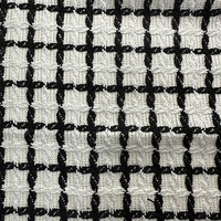 Tissu en tweed de polyester teint en fil noir et blanc à carreaux de haute qualité pour vêtements