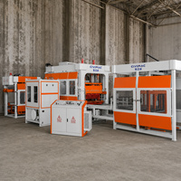 Machine de fabrication de blocs de béton entièrement automatique QT9-15S contrôlée par PLC, pour blocs creux, pleins, pavés, briques autobloquantes et bordures.