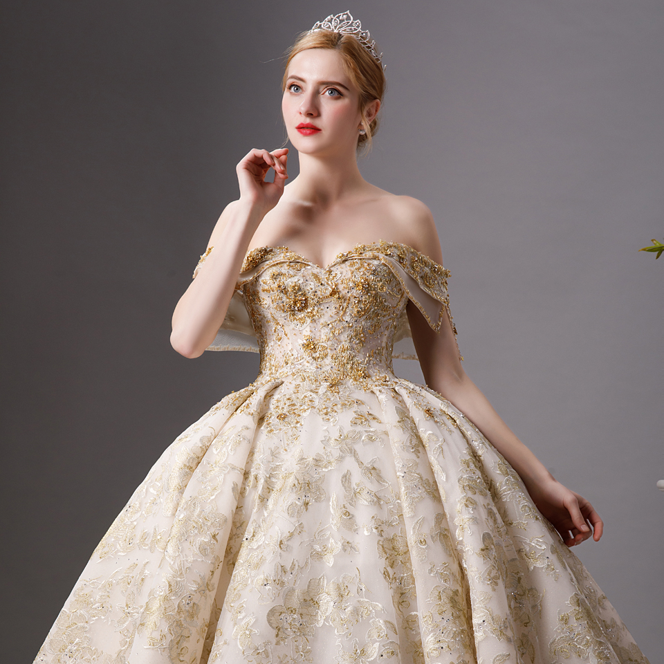 Encuentre el mejor fabricante de vestidos de novia blanco con dorado y  vestidos de novia blanco con dorado para el mercado de hablantes de spanish  en alibaba.com