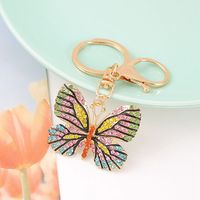 Porte-clés Papillon Créatif Scintillant et Coloré en Alliage Métallique Léger avec Strass pour Décoration de Sac à Main Femme
