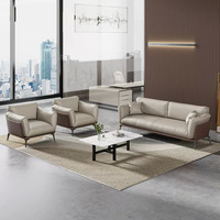 Ensemble canapé et table basse en cuir de bureau simple et moderne pour une réception d'affaires décontractée