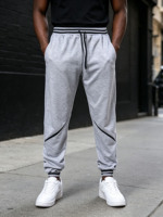 Pantalon de jogging décontracté pour homme en toile droite avec cordon de serrage élastique, design à ligne contrastante, style streetwear sportif