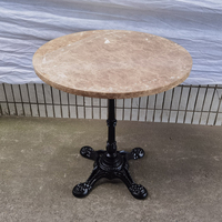 Table de restaurant moderne en marbre, ronde, avec base en fonte à colonne unique, vente en gros