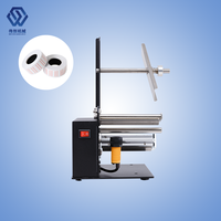 Machine portative de rebobinage de rouleaux d'étiquettes adhésives et d'étiquettes autocollantes de codes à barres