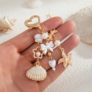 พวงกุญแจจี้รูปเปลือกหอย/ปลาดาว สไตล์ทะเล สำหรับผู้หญิง แฟชั่นโบฮีเมียน ชุบทอง ตกแต่งกระเป๋า ของขวัญเครื่องประดับแฟชั่น - Product Image 1
