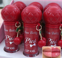 Vente en gros d'huile à lèvres rose très prisée avec breloque cerise, ensemble de porte-clés huile à lèvres portable mignon, style cerise, coffret cadeau pour le soin quotidien des lèvres
